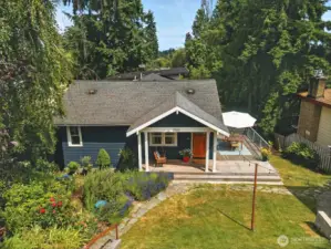 Front exterior with rocking swing front deck and entertaining side patio