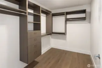 Primary bedroom walk-in closet