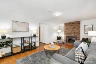 The living room can be accessed from the kitchen and from the hallway that goes to the garage/utility room and 3/4 bath.