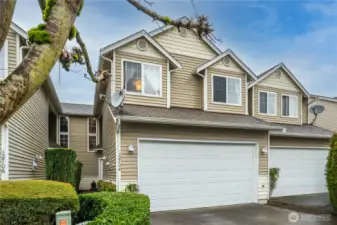 Great townhome with 2 car garage and 2 parking spaces in driveway