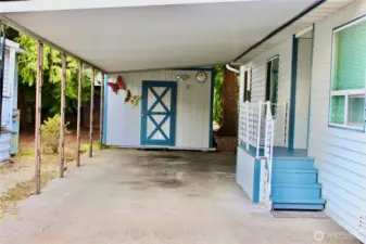 The carport and shed that's locked with its own key to unlock