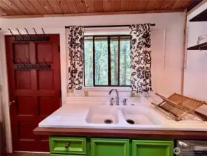 Large farmhouse sink adds to this charming little kitchen