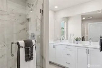 Serene primary bath designed with a double vanity and timeless finishes. Staged image from a different home of the same plan.