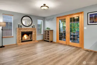 French doors open to a covered and uncovered deck space, ready for year-round enjoyment.