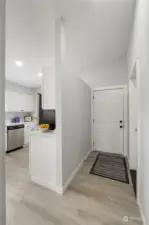 Entry hall to the front door and to the garage, on right.