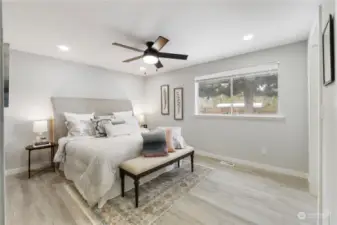 New lighting, ceiling fan, flooring & paint in this Large Primary Bedroom Suite!