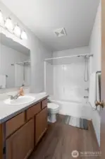 The upstairs bathroom with plenty of counter space and storage.