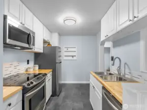 Room for abookcase or rolling trolley for additonal counter space if needed.