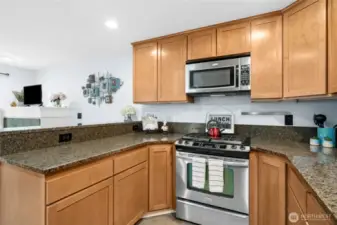 Spacious kitchen with ample granite  countertop space