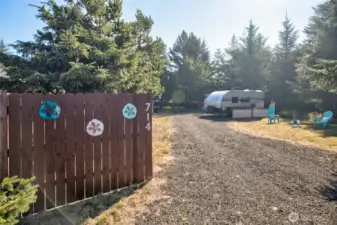 Enjoy the best of nature with modern comforts on this cleared lot featuring full hookups (water, power, sewer) and privacy fencing. Surrounded by trees on three sides, with a gravel-packed driveway for easy access.