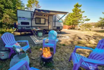 Backed by beautiful trees and protected by a privacy fence, this clean, gravel-packed lot includes water, sewer, and power for a hassle-free stay