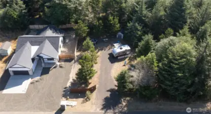 Bring your RV to this cleared, gravel-packed site with full hookups. Surrounded by natural beauty and fenced for privacy, it’s a slice of comfort in the wild.