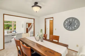 Formal dining room with convenient access to the both the kitchen and living room