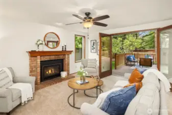 Inviting family room with gas fireplace and French doors that open to the deck and rear yard