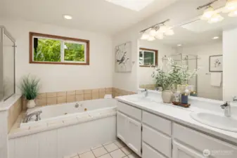 Ensuite bath features a double vanity, jetted tub and shower