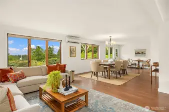 Spacious dining area centered between the living and kitchen nook. Notice the ductless heat pump which provides AC and heat!