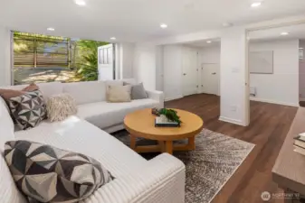 Indoor/outdoor family room on the lower level for an easy "spill out" zone. Ideal for media, workouts, studio or play