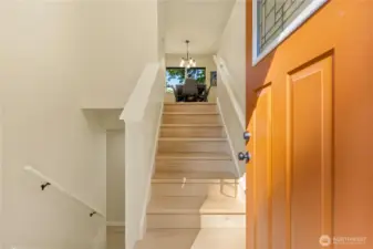 Freshly painted walls and new flooring greet you as you enter.
