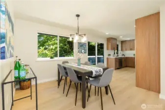 The dining room is just off the kitchen and adjacent to the living room. There is new vinyl plank flooring throughout the home.