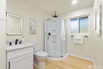 The downstairs bathroom has a large shower and built-in storage (not pictured).