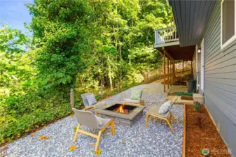 The low maintenance back yard has a built-in fire pit for your enjoyment. It's so tranquil here - it feels like you're camping!