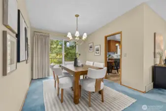 Formal dining room with easy access to the kitchen and your back patio, complete with trex deck overlooking your large lot