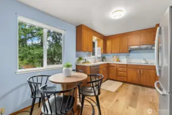 Spacious kitchen, complete with eating area, new vinyl plank floors, new dishwasher and new oven