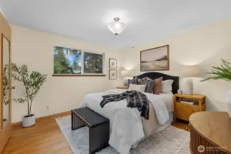 Welcome to your primary bedroom with hardwood floors, ample closet space and .75 bath