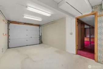 This garage bay would be a perfect home gym, additional storage or easily converted back to a garage for your vehicle.  Door is fully functional