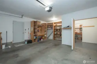 Deep garage with shelving.