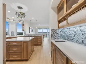 Stunning custom cabinetry. Beverage chiller & wet bar.