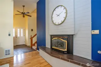 This gas fireplace is the anchor.  Love the mix of stone and hardwood floors.