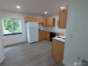 Efficient kitchen space with a roomy pantry.  Refrigerator, stove and dishwasher!
