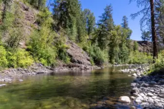 Stunning riverfront retreat in the Twisp River Valley.