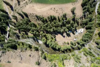 The property has approximately 800 feet of private river frontage with numerous level clearings.