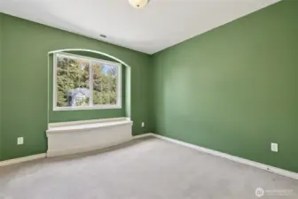 3rd bedroom w/sitting bench and storage