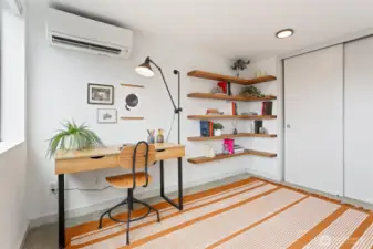 Office with solid oak shelves, and more space for guests if needed.