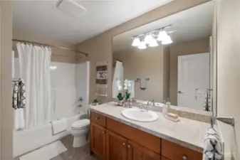 The upstairs bathroom is plenty large and has ample counter space.