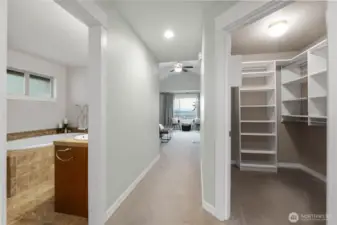Your primary suite is HUGE with TWO closets (the large walk-in closet is pictured here), and a 5-piece en suite bathroom.