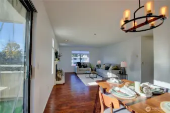 Nice open flow from living room, dining room, and covered balcony