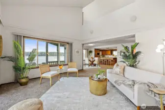 Light-filled great room with picture windows framing views of the Harstine Island Bridge and Puget Sound.