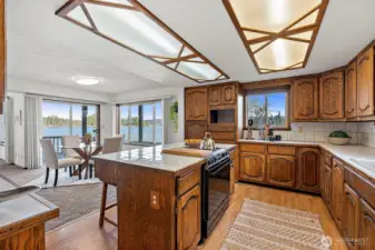 Well-appointed kitchen featuring an island, generous cabinet space, and scenic water views.