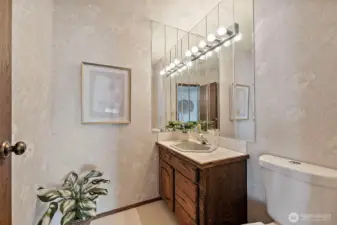 Main-level powder room easily accessible from living areas.