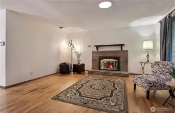 Gas fireplace and Beautiful refinished hardwood flooring welcomes you home