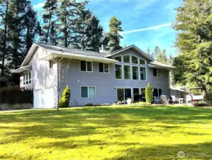 BEAUTY, PRIVACY AND ACREAGE. This 3 bedroom, 2 1/2 bath custom built home sits on a little over 2 acres.