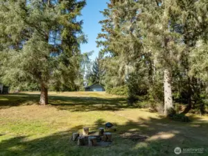 Facing west up the slope. Can see the large garage.