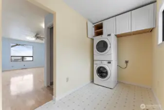 utility room off of kitchen and next to finished bonus room