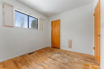 bedroom 2, original wood floors, new window