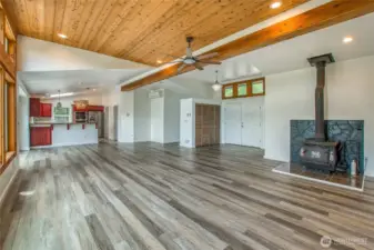Entry opens to the living room and kitchen, and the office or exercise room is just around the corner.