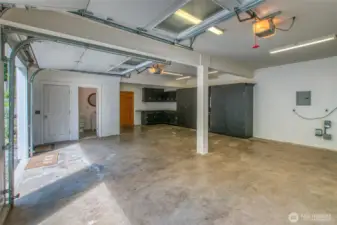 2 car garage with a half bath, and space for a shop.